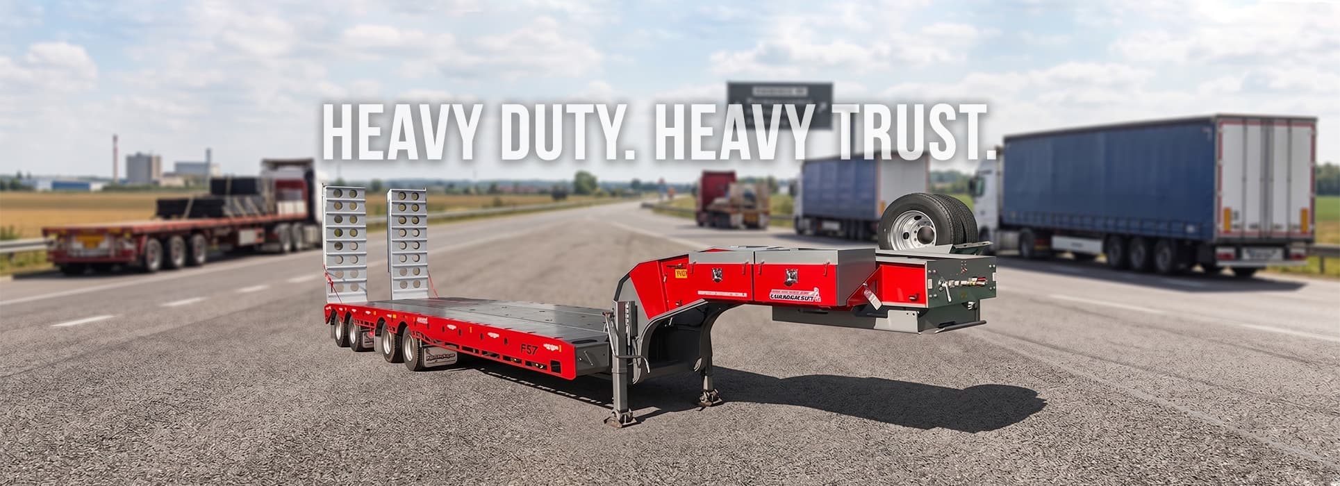 Freightmore lowboy trailer on the highway — Heavy duty. Heavy trust.